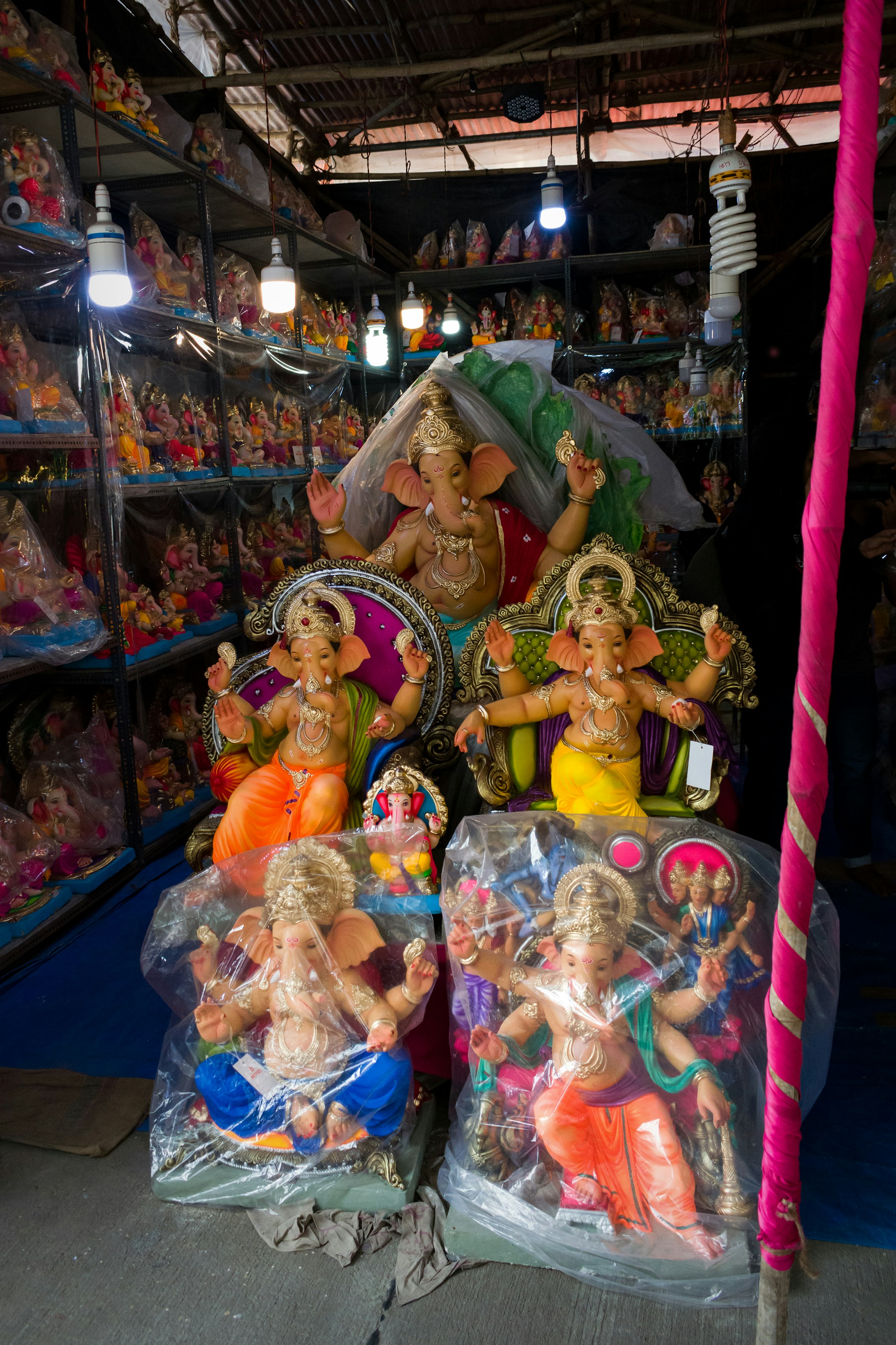 hindu deity figurine on purple textile